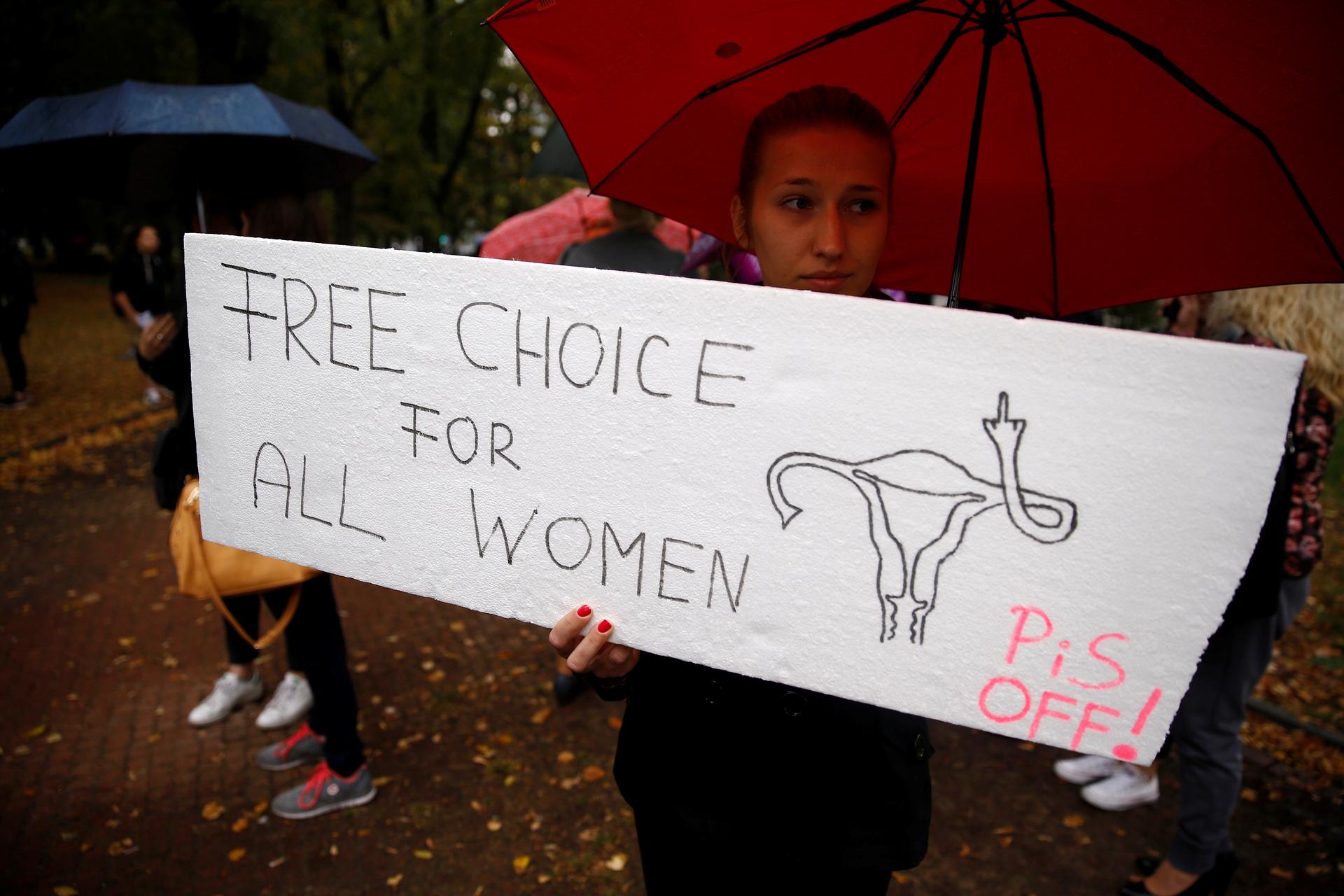A woman holds a placard in an abortion rights campaigners' demonstration