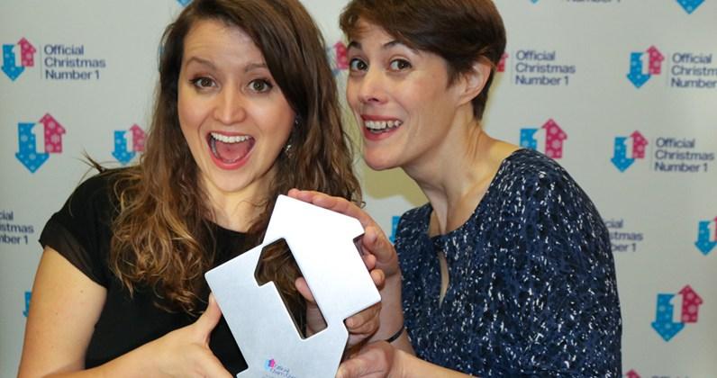 Children’s doctor Katie Rogerson (left) and children’s physiotherapist Caroline Smith of the NHS choir with the Official Christmas No 1 award for charity single A Bridge Over You, beating  out Justin Bieber.