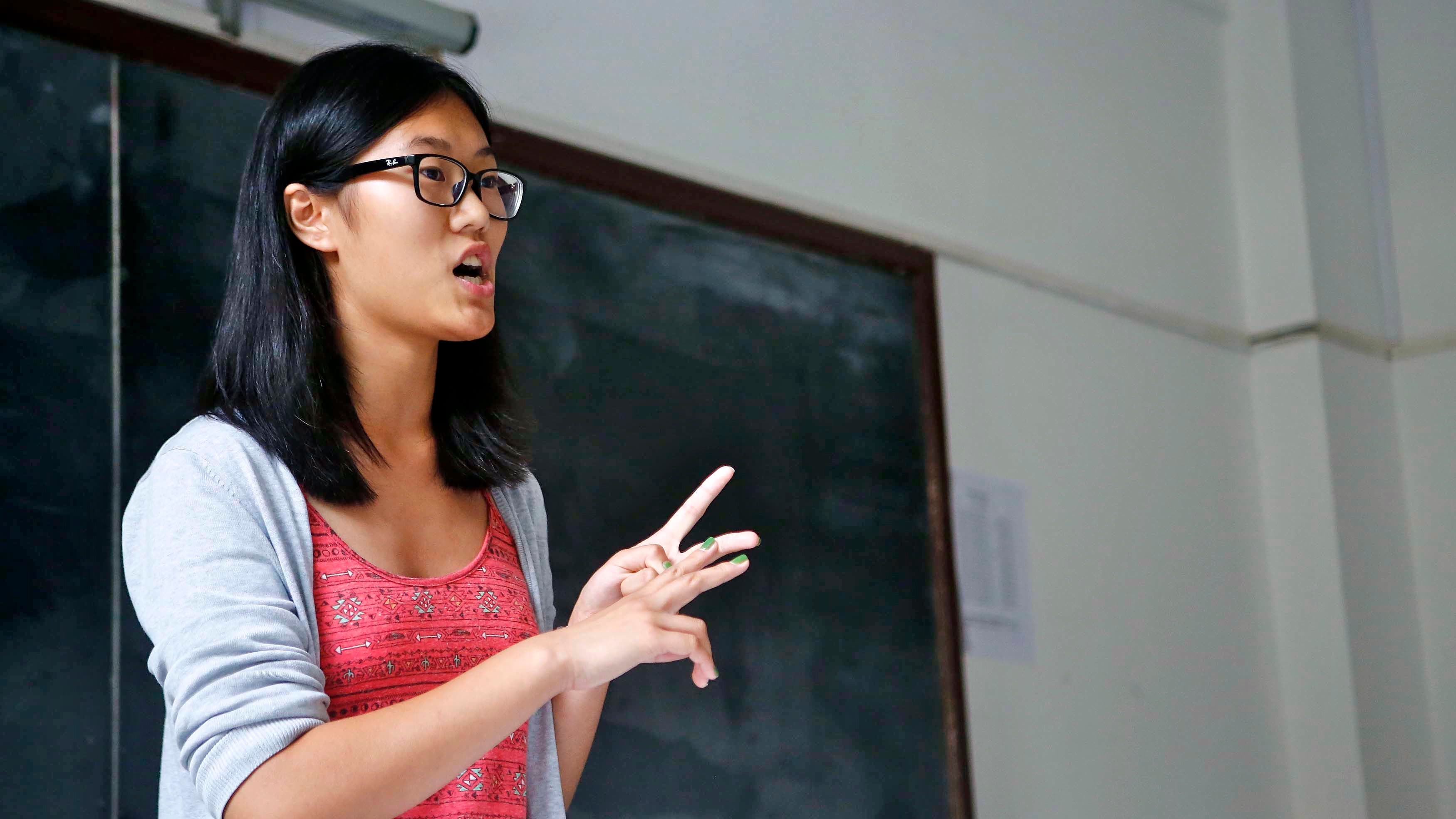 A participant in the inaugural Shanghai International Debate Open 2014. Motions ranged from whether police should bear arms to whether ransoms should be paid to terrorists for the release of hostages.