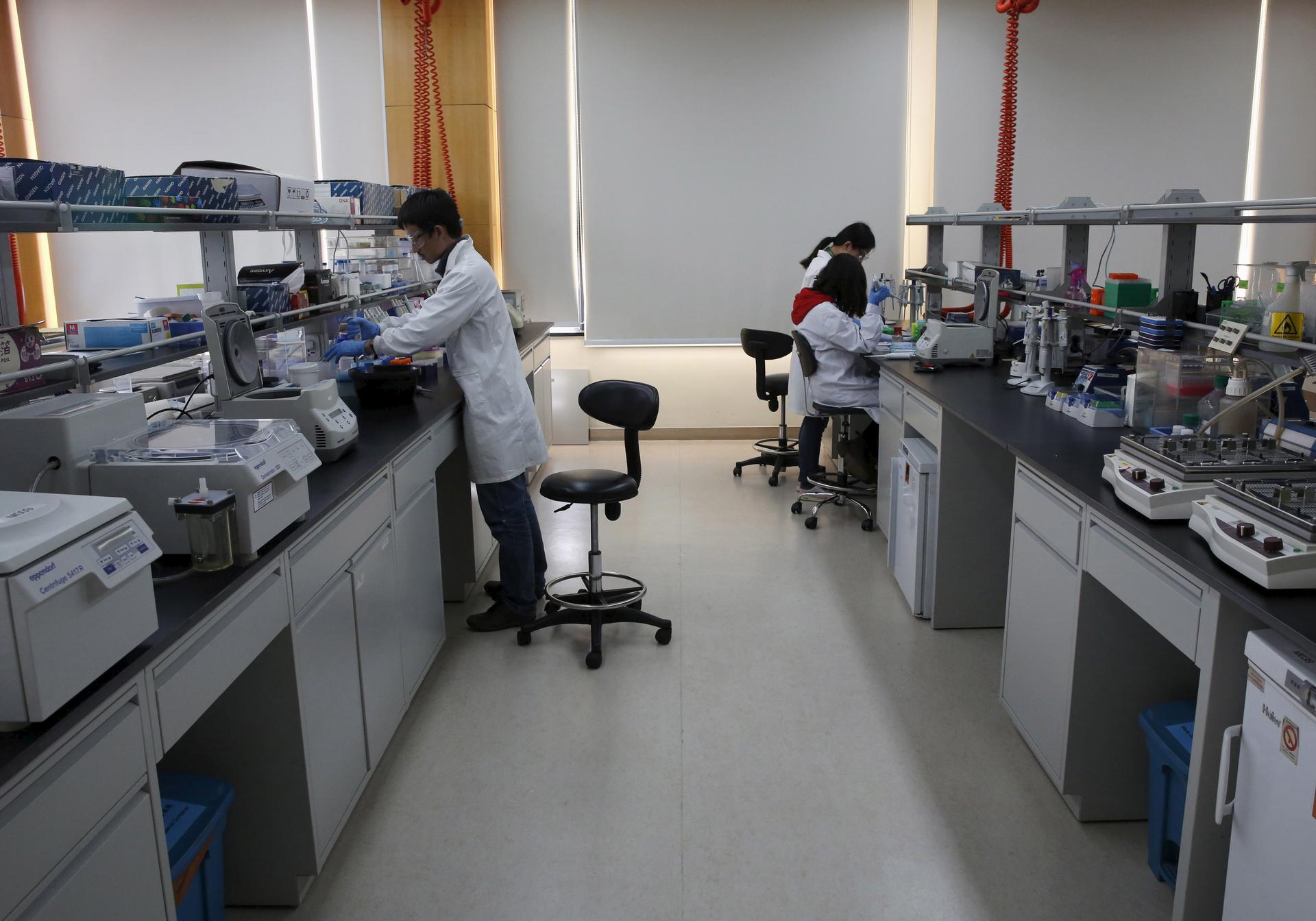 Researchers work at a lab in Syngenta Biotech Center