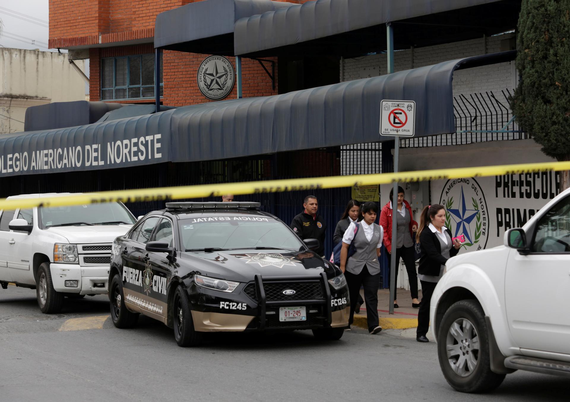 People leave the Colegio Americano del Noreste