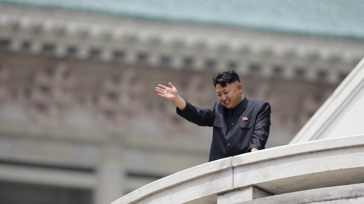 North Korean leader Kim Jong-un waves to the people during a parade in Pyongyang July 27, 2013.