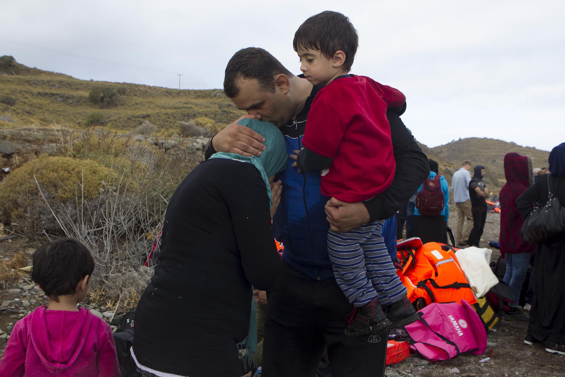 Syrian family embrace after making journey to Greece