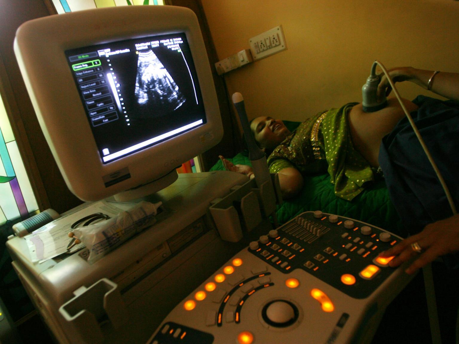 Shabnam, a surrogate mother, has an ultrasound at Patel's clinic in Anand, in the western Indian state of Gujarat on March 4, 2009.