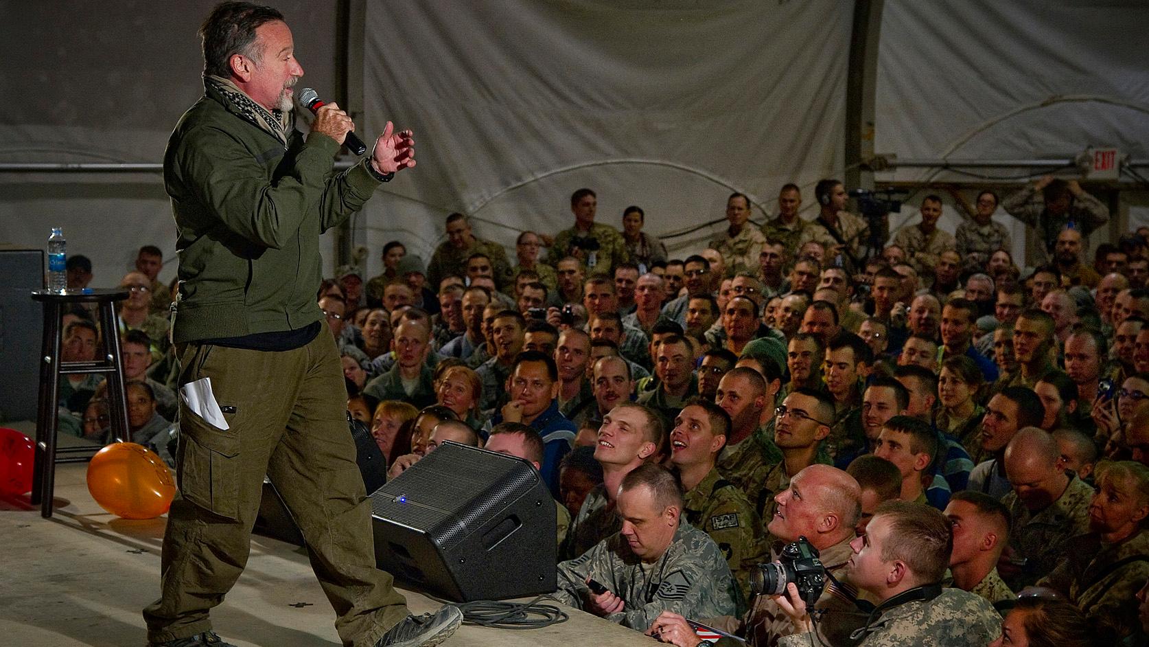 Robin Williams entertains troops during a USO performance.