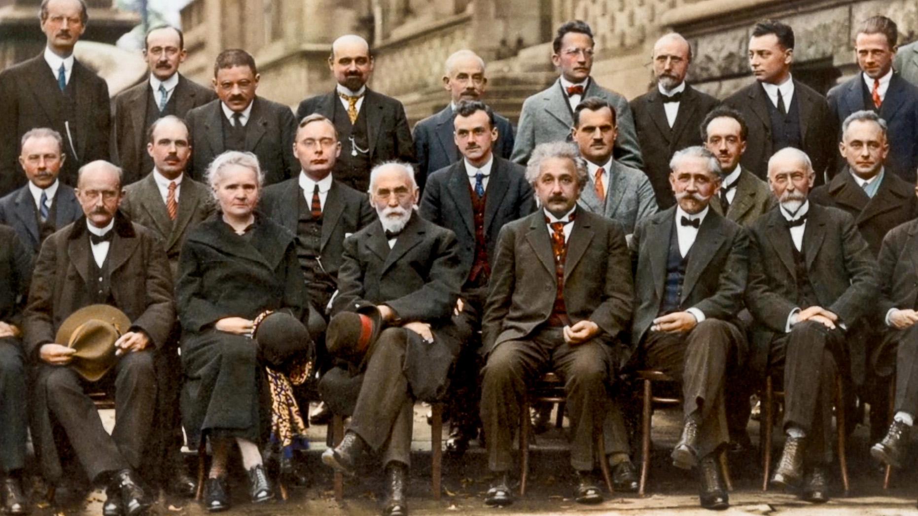 From the October 1927 Fifth Solvay International Conference on Electrons and Photons. Hendrik Lorentz, Leiden University, seated between Madame Curie and Einstein, chaired the conference.