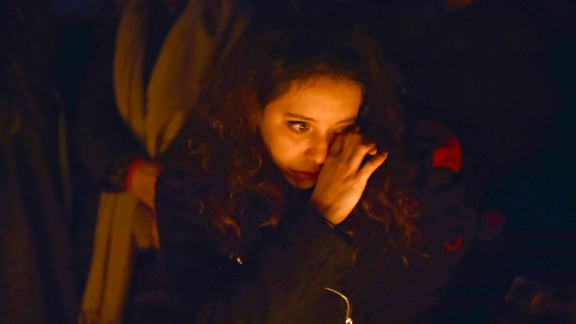 A woman in Trafalgar Square weeps at a vigil for victims of the London terrorist attack