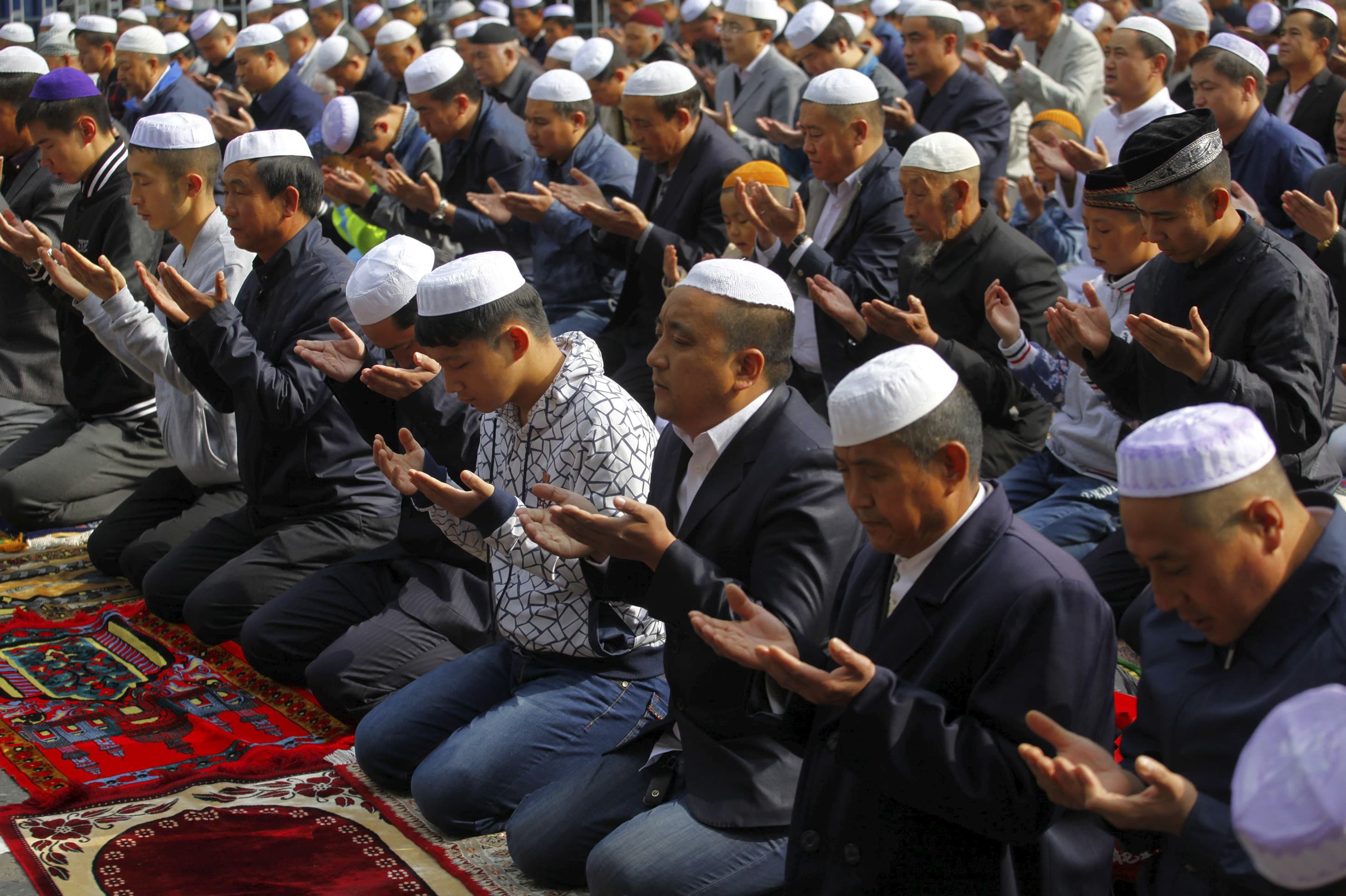 Muslims attend a mass prayer at the Dongguan Great Mosque, in Xining, Qinghai province, China.  The Islamic State has a song in Mandarin calling on Chinese Muslims to join the jihad.