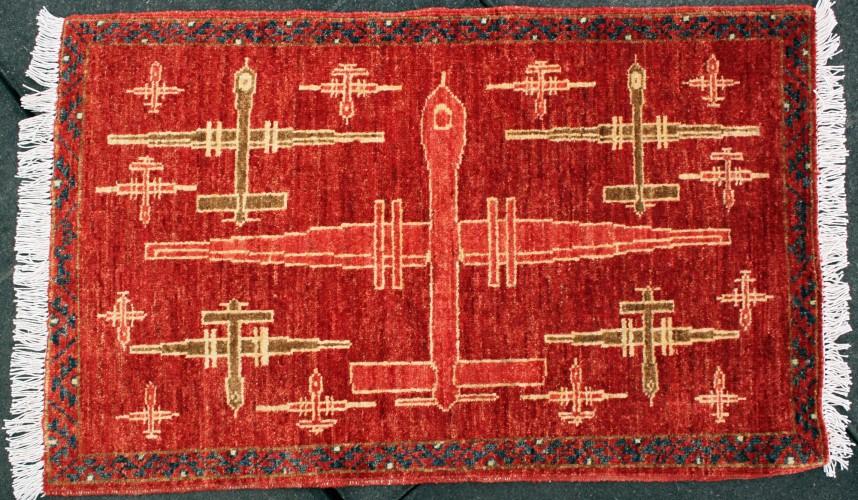 Predator drones featured on a hand-woven rug from Pakistan.