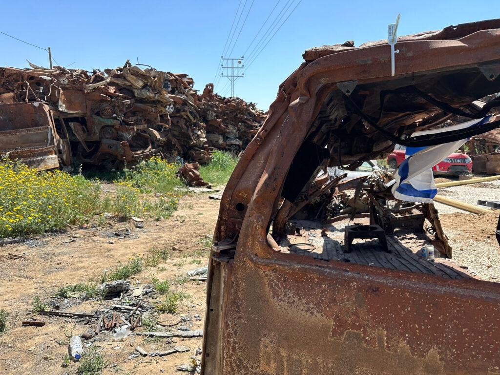 A car destroyed during Oct. 7 attacks in southern Israel sits in a large "graveyard of cars" gathered from that day.