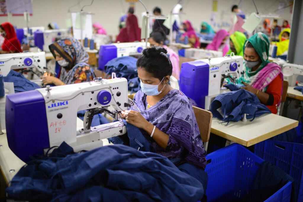 Garment employees work at Arrival Fashion Limited in Gazipur, Bangladesh, Saturday, March 13, 2021.