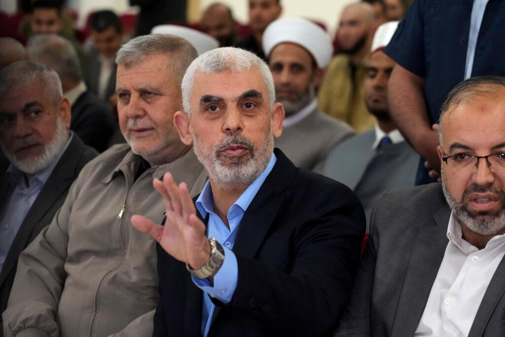 Yahya Sinwar, head of Hamas in Gaza, greets his supporters upon his arrival at a meeting in a hall on the sea side of Gaza City, on April 30, 2022.