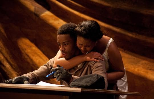 Bigger (Eric McCalister) writes a ransom note while Clara (Ashley Brooks) begs him to stop. (Tom Patterson)  