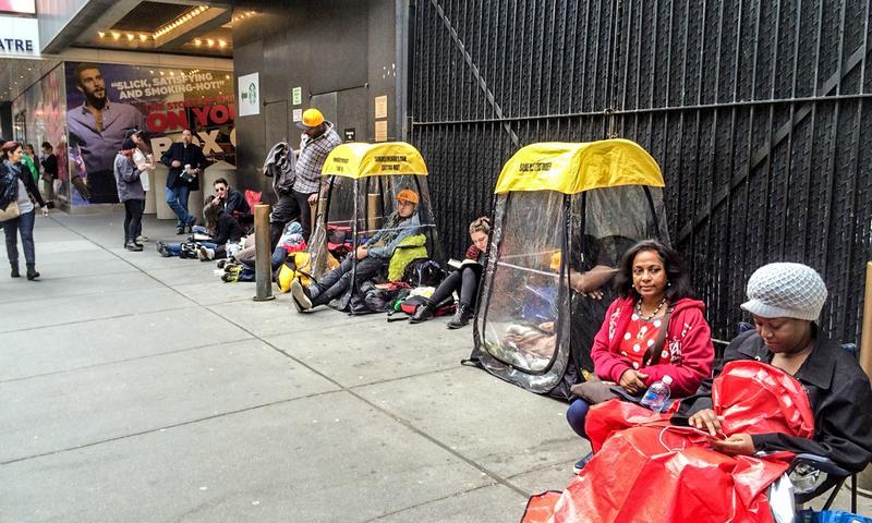 Chitra Rameswaram (second from right) waits in line in front of the Richard Rodgers Theatre, hoping for day-of tickets to 