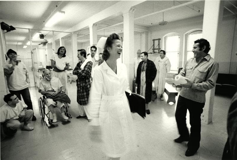 Louise Fletcher on the set of One Flew Over the Cuckoo's Nest with the cast and director Milos Forman (at right). 