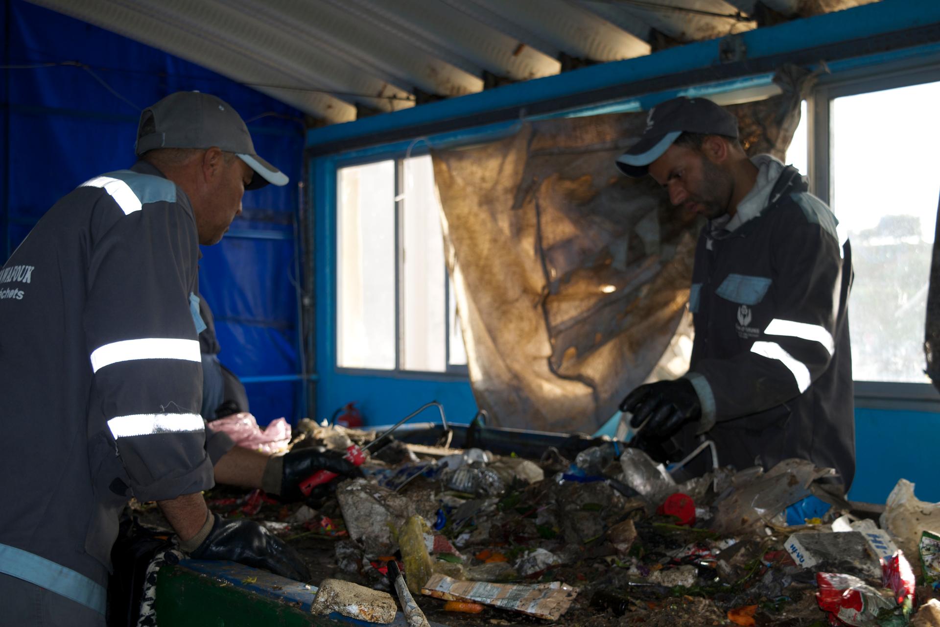 The former trash pickers went from competitors for junk at the dump to co-workers at the new recycling facility. Together they recycled more than 12,000 tons of trash in 2016. Backers hope the new facility will be a model for others around the world.