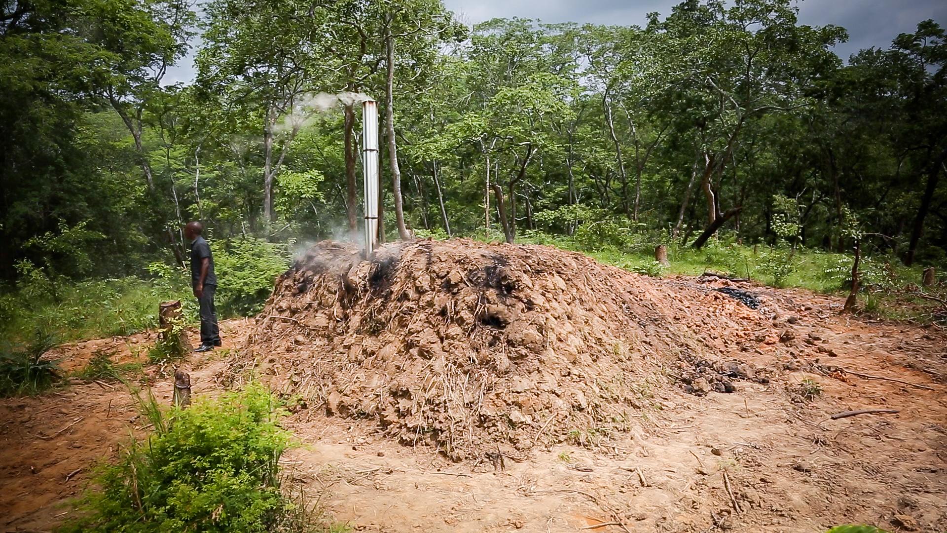 : Sustainable charcoal producers in Kilosa use an improved basic earth kiln to produce charcoal more efficiently. The process takes longer—about a week—but the end product is a longer and cleaner burning charcoal.