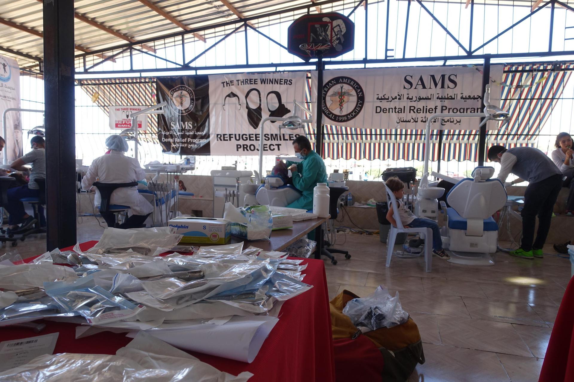 With funding from the Project Refugee Smiles fundraiser, the Syrian American Medical Society bought eight dental chairs for the temporary clinic set up at the Al-Salaam School in Reyhanli, Turkey.