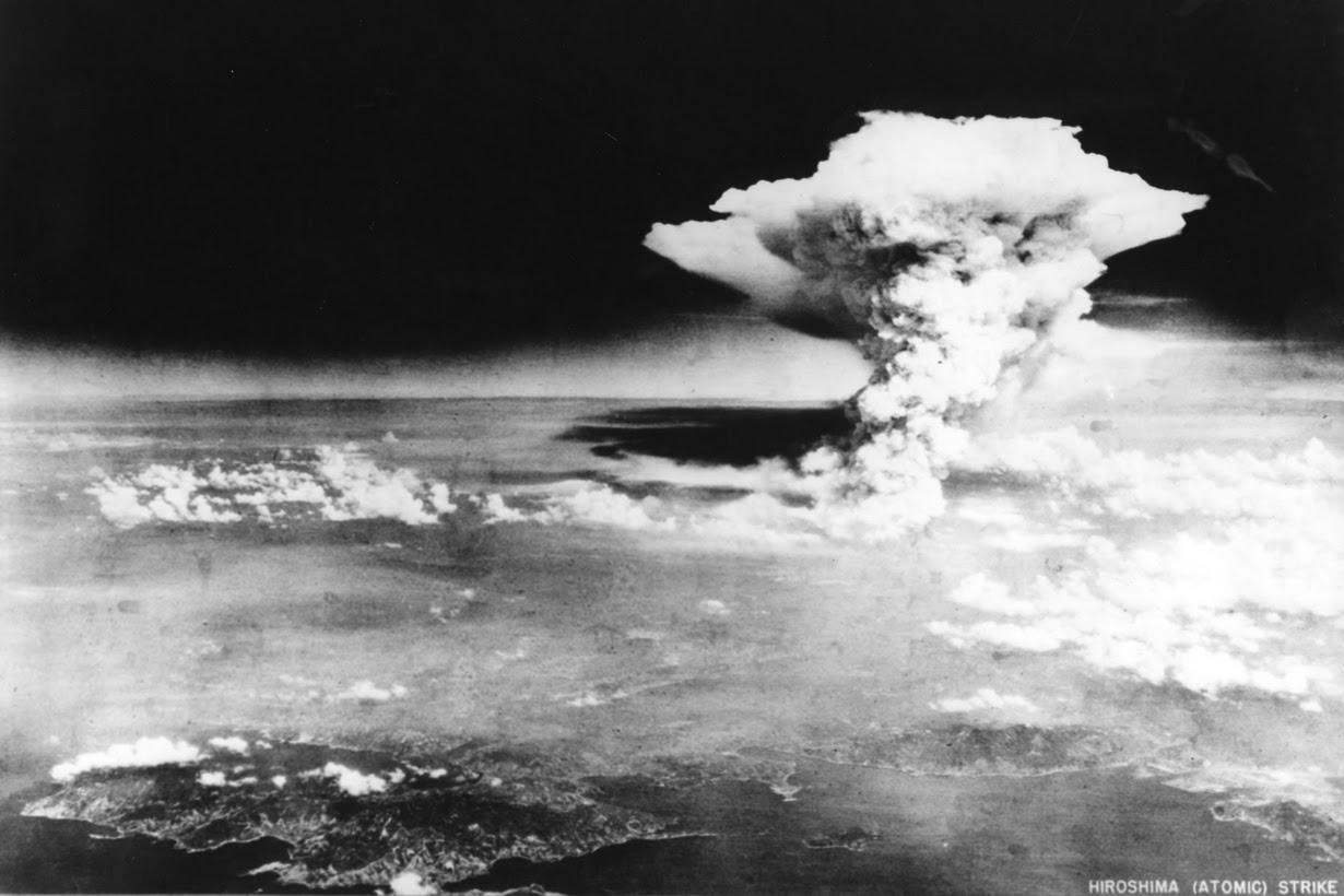 An atomic cloud billows, following the explosion of the first atomic bomb to be used in warfare.