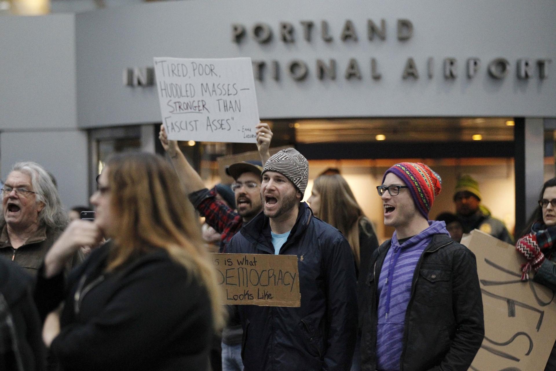Activists gather at Portland International Airport to protest against President Donald Trump's executive action travel ban in Portland.