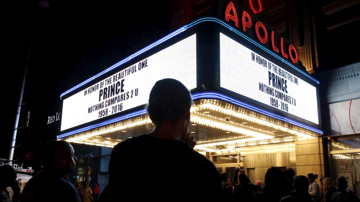 The marquee at Harlem's Apollo Theater pays tribute to Prince as fans gather to celebrate his life and music.