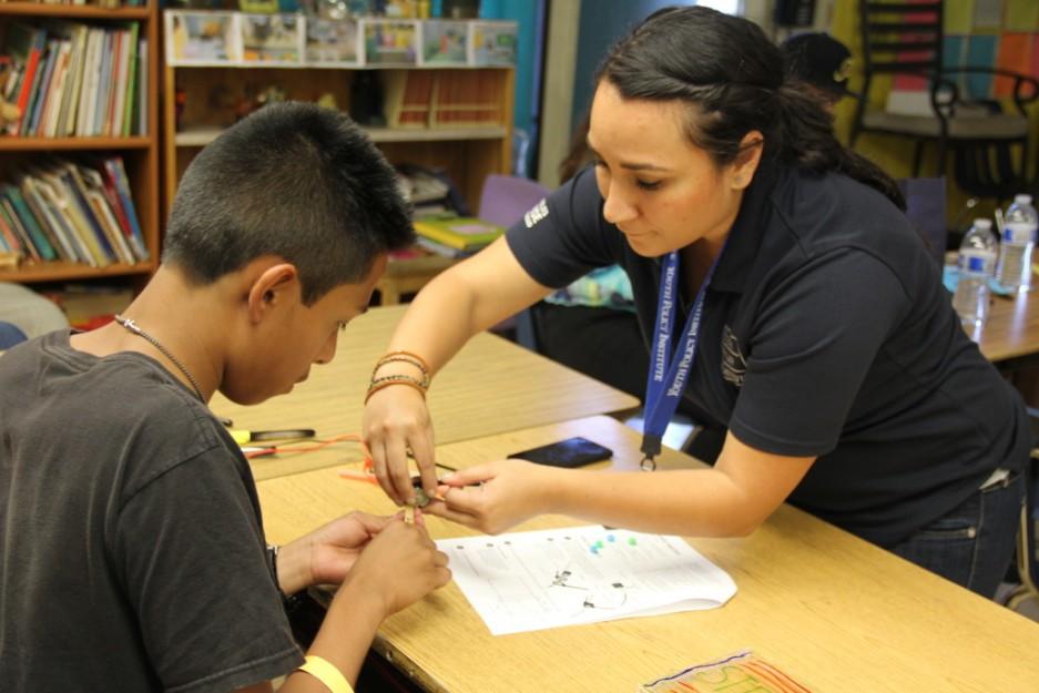 An AmeriCorps volunteer works with a student at Los Angeles's Youth Policy Institute.