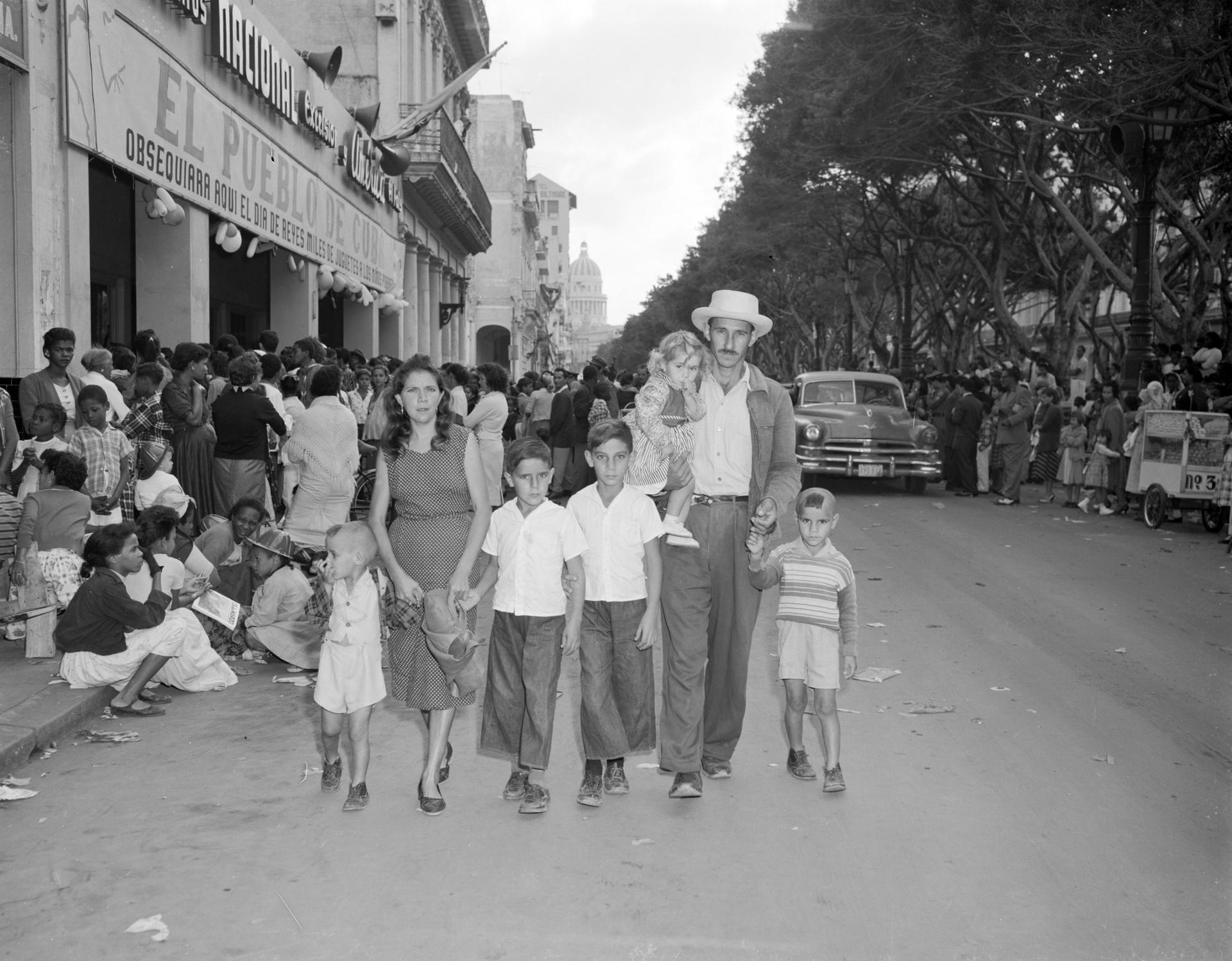 January 11, 1959 - Havana, Cuba - These five little brothers, accompanied by their parents, leave a local broadcast station, and walk down The Prado empty-handed. They had come seeking toys that were being given away on January 11, declared a holiday.