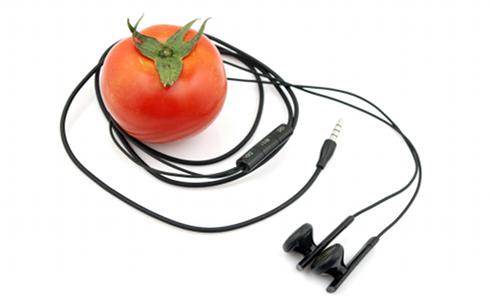 A tomato with headphones