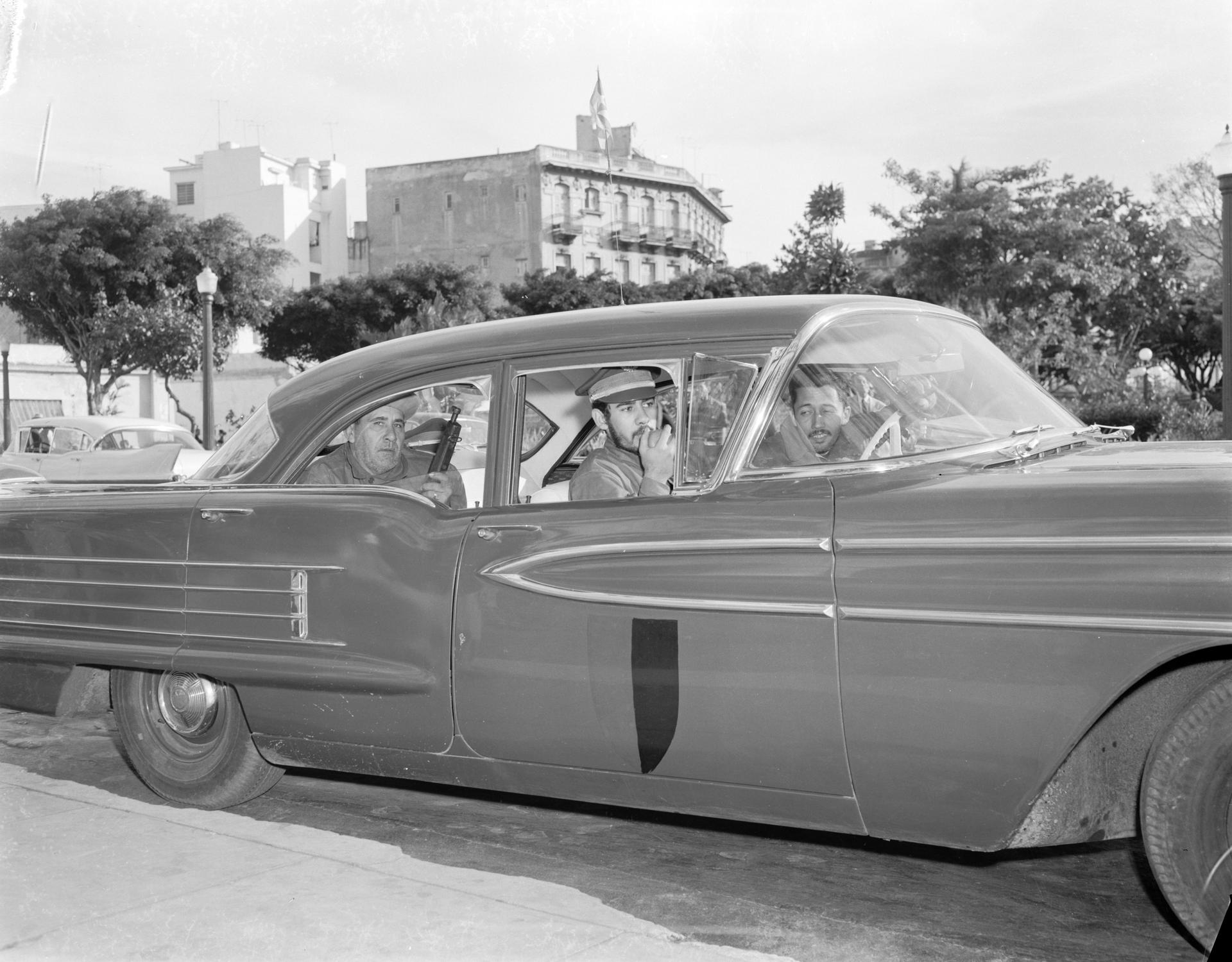January 1959 - Havana, Cuba - In an automobile that used to be in the service of ex-dictator Batista, three soldiers of the 
