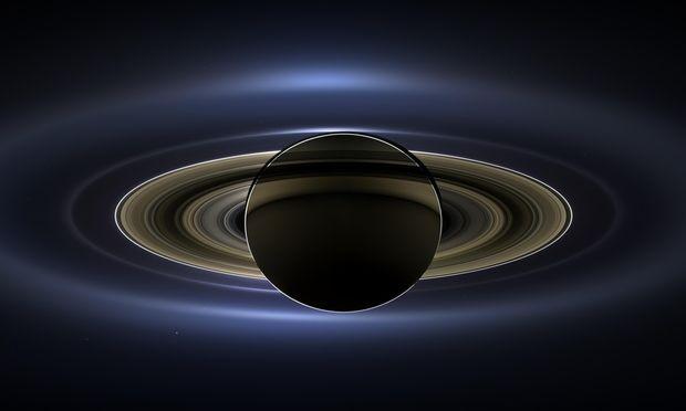 The planet Saturn is seen backlit by the sun, as seen from the Cassini spacecraft on July 19, 2013.
