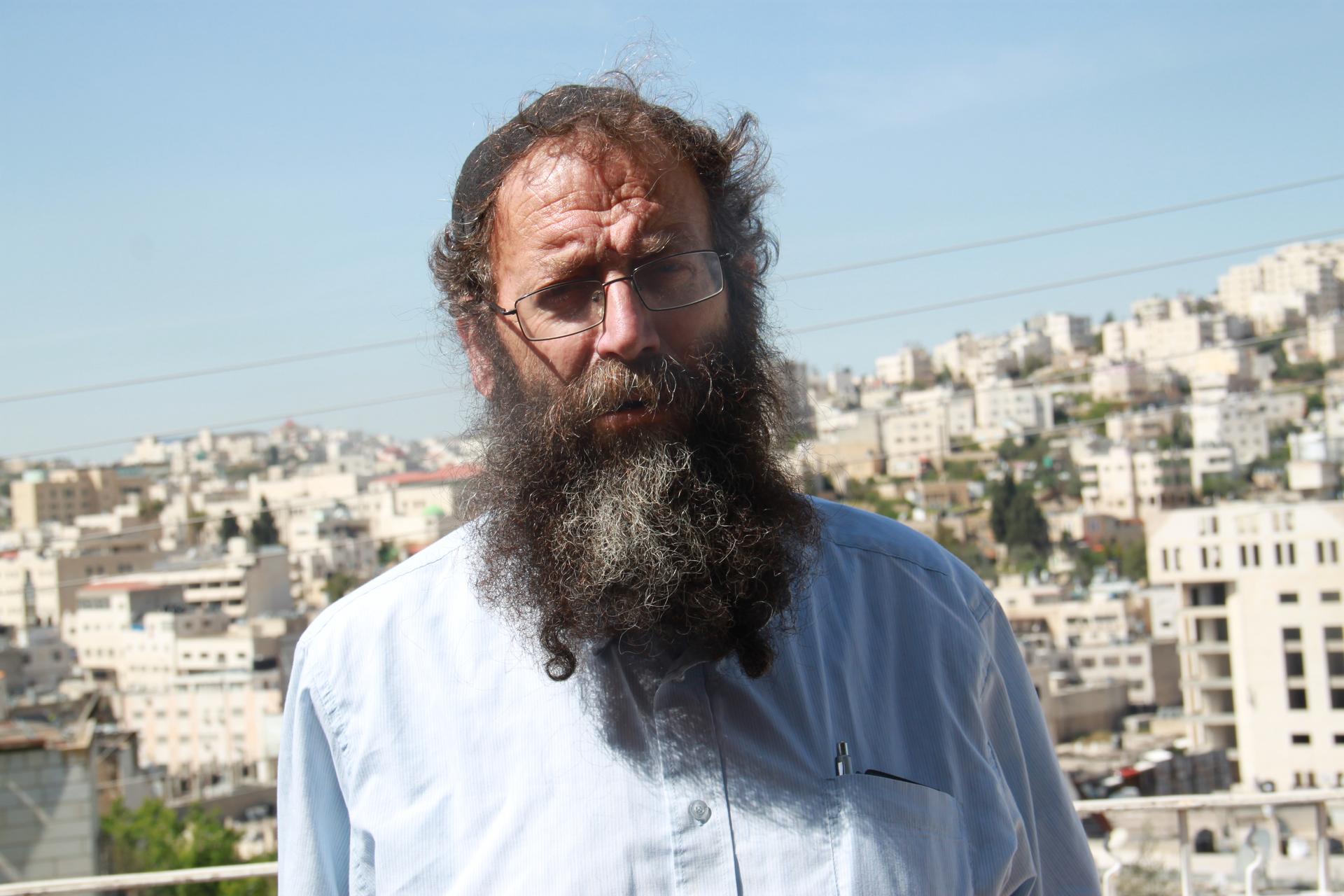 Baruch Marzel, an ultra-nationalist Israeli, shook the hand of the Israeli soldier who shot a suspected Palestinian attacker lying on the ground in Hebron. 