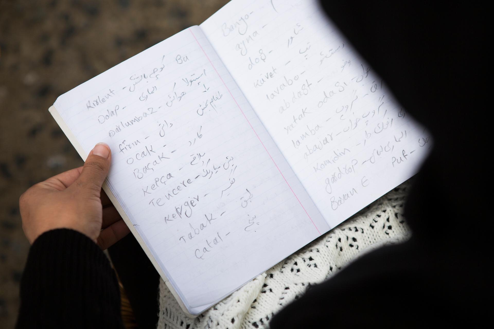 In her notebook, Hoor writes Turkish words