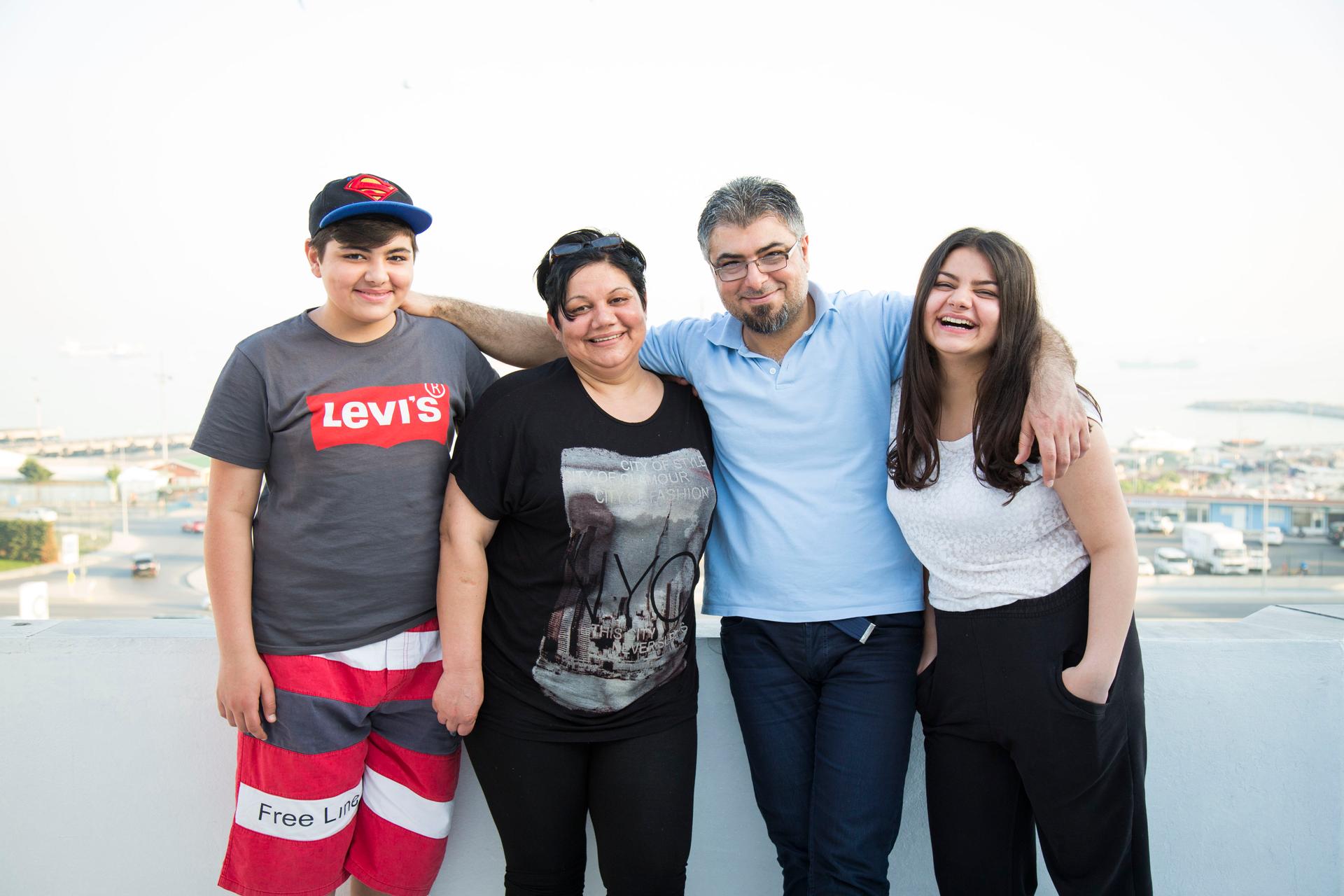 From left, Jan, Souad, Nezmy and Loury pose for a photograph outside their home in Istanbul.