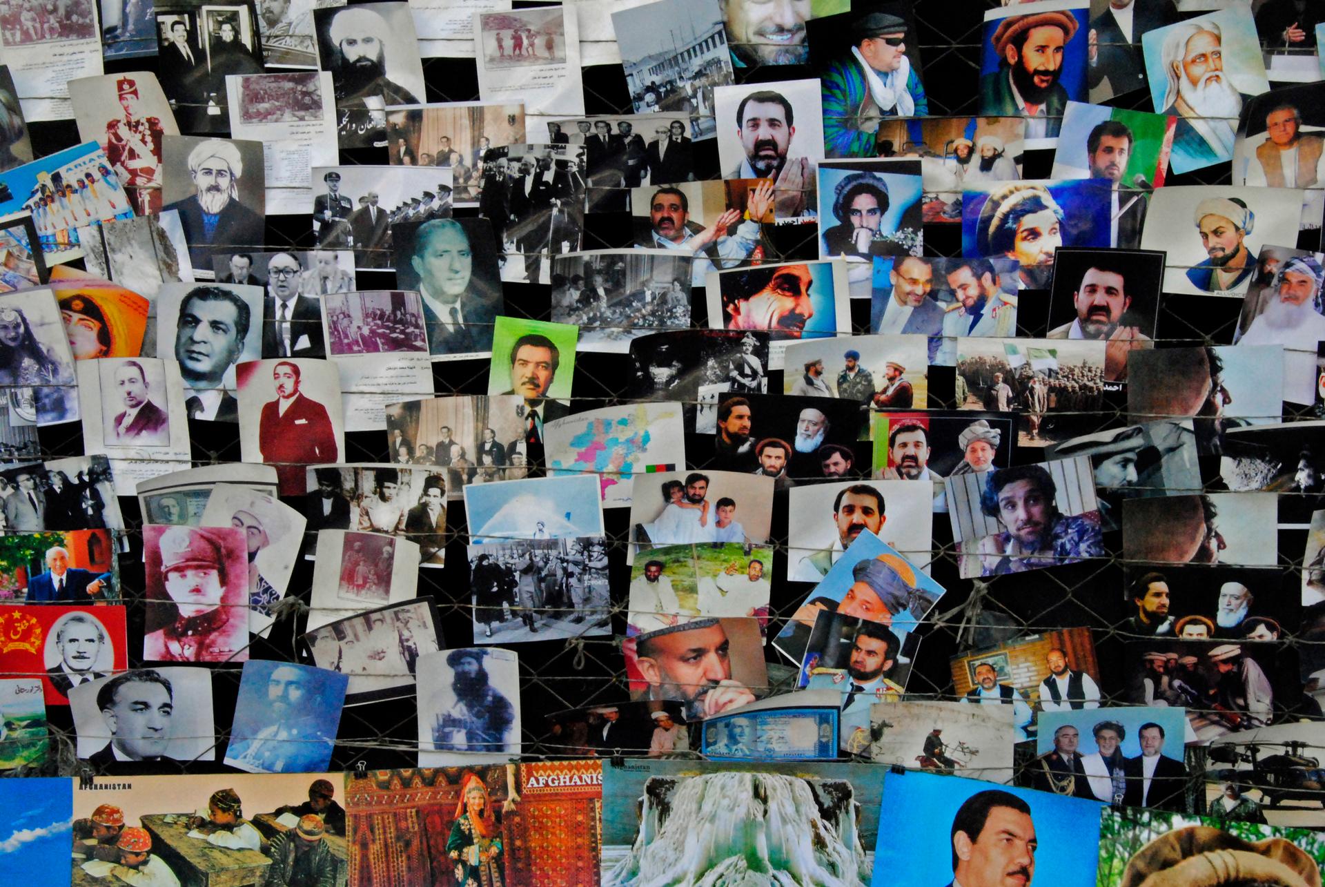 A postcard seller displays images of famous Afghans in Kabul.
