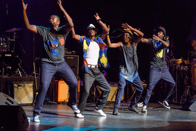 Mokoomba dancing on stage at Apollo Theatre.
