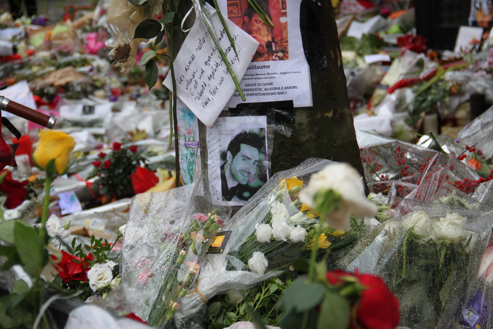 The patio in Paris where cafegoers were shot dead on November 13 is now a sea of bouquets, notes and photos of victims.