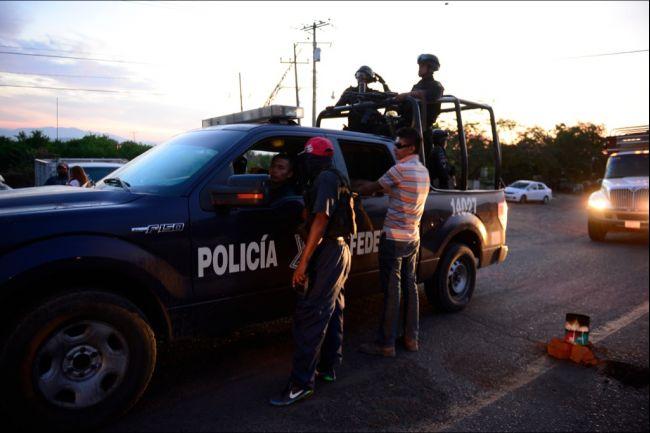 Mexican federal police and militias can be friends, for now.