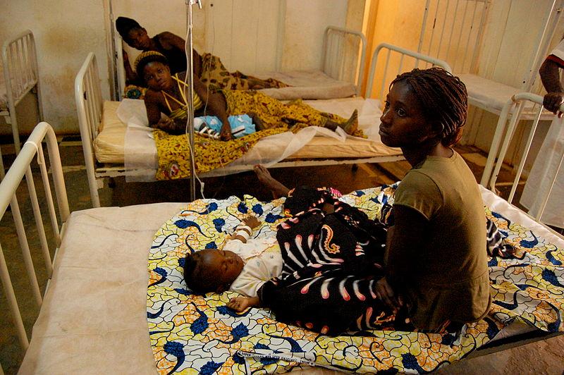 Women wait by their sick babies while they receive treatment for malaria in municipal hospital of M'banza-Kongo, the capital of Angola's northwestern Zaire Province, in 2006.