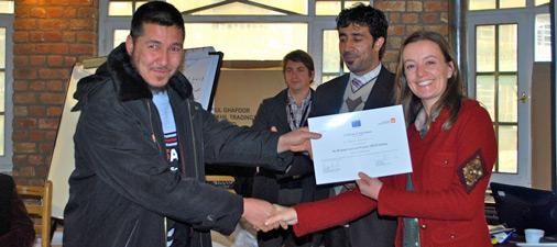 Participant receiving Certificate of Attendance at the end of the training.