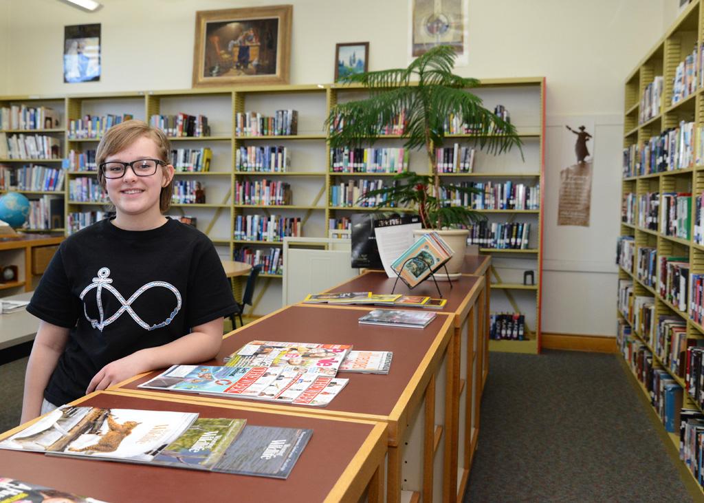 14-year-old Shawnee, in the library at the Wyoming Girls' School in Sheridan has found coding helps her be at peace.