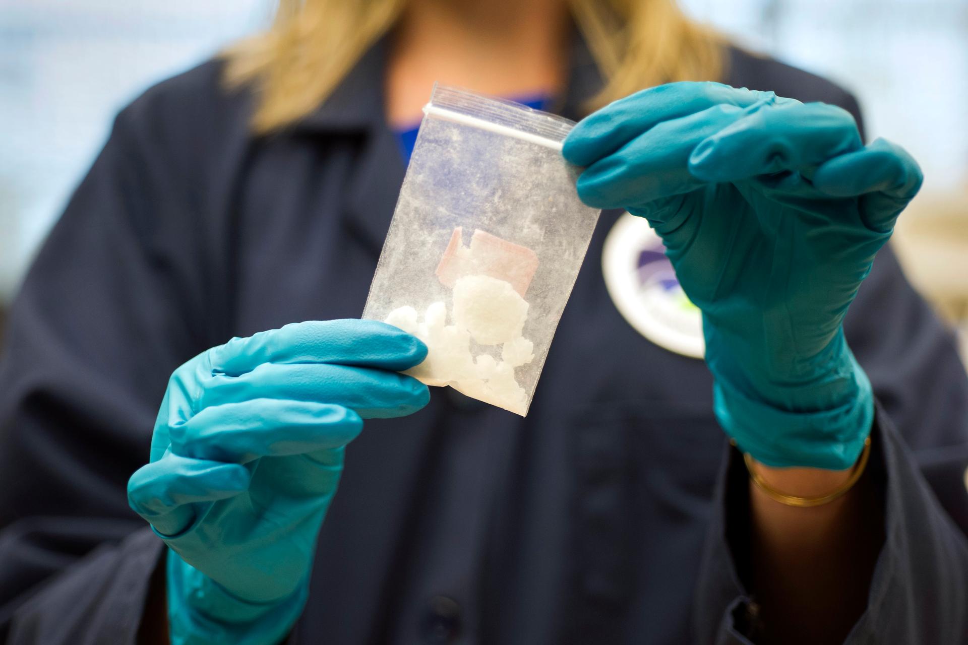 A bag of 4-fluoro isobutyryl fentanyl which was seized in a drug raid is displayed at the Drug Enforcement Administration (DEA) Special Testing and Research Laboratory in Sterling, Va. The DEA is setting up an office in China to work with Beijing to try t