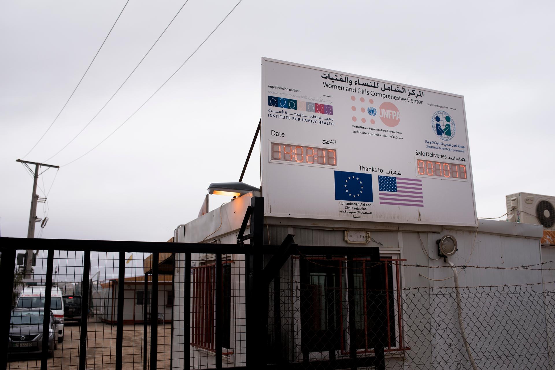 A placard outside Zaatari's JHAS Women and Girls Comprehensive Center, where the materiny ward is housed, displays the time, date and number of babies delivered at the center.