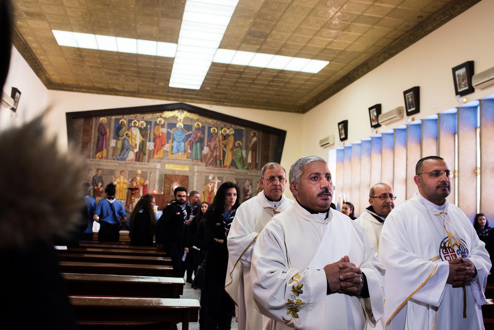 A congregation of Jordanian priests gather for a ceremony at Marka's Latin Church, in the outskirts of the capital Amman.