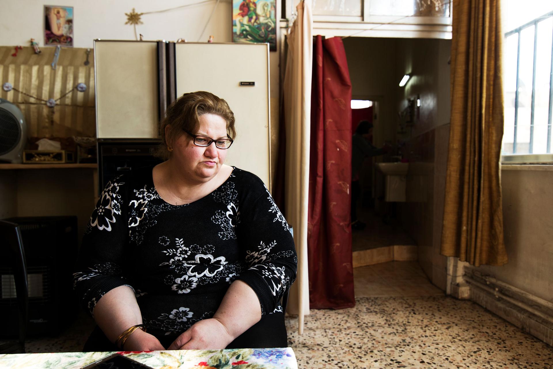 Ghaida Hekmat is the only one of her family still waiting at the St. Mary's Church.