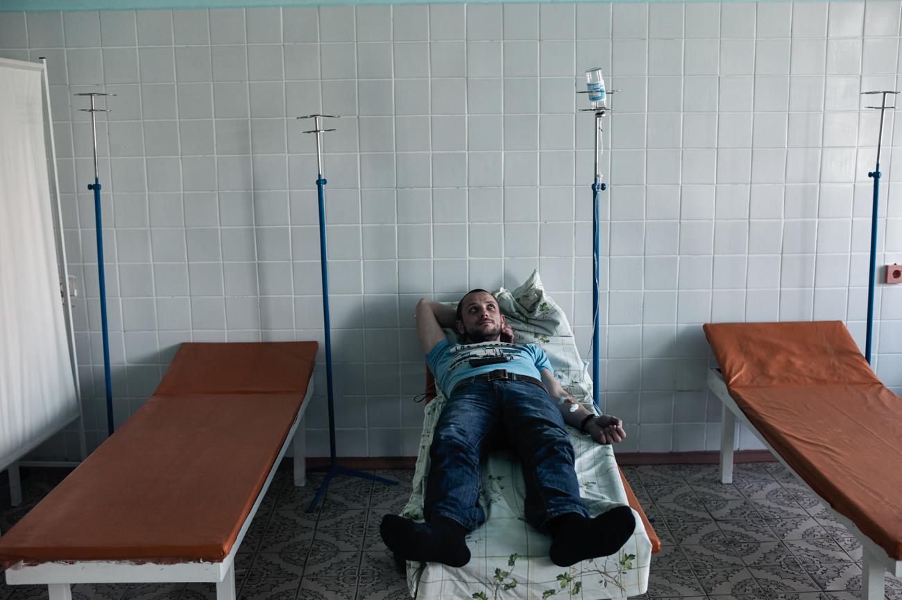 Aleksei Morozov undergoes an IV treatment in a military hospital in Kiev for a head injury he sustained in battle two years ago. Morozov, who is HIV­positive, joined a volunteer battalion and was later held prisoner in Eastern Ukraine.