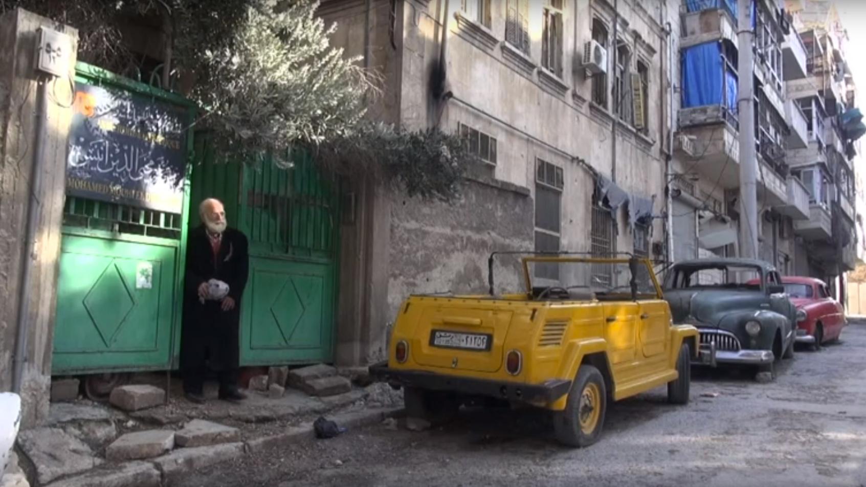 Abu Omar and his collection of vintage cars in Aleppo, Syria.