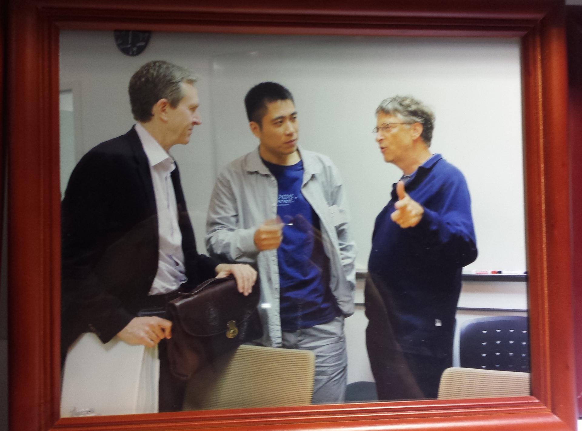 Wang Jun, former BGI Chief Executive, with Bill Gates, in photo displayed at BGI
