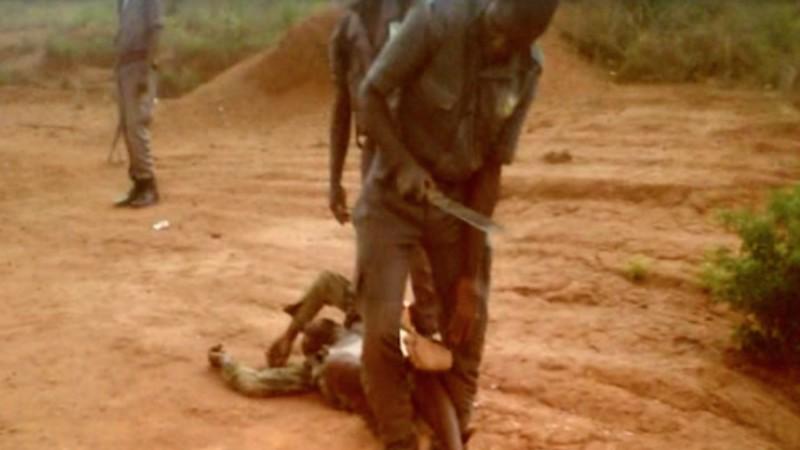 Screenshot of man beating another man, who is on the ground