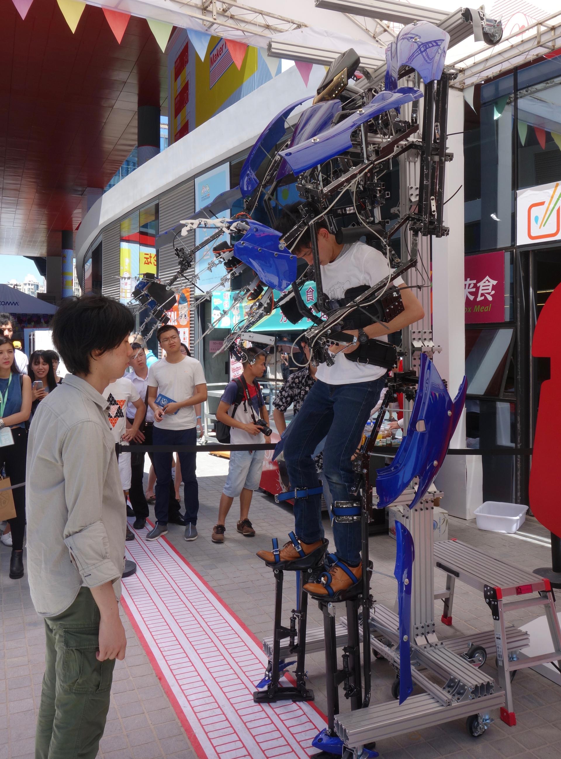 Stepping into a robot suit at the 2015 Shenzhen Maker Faire