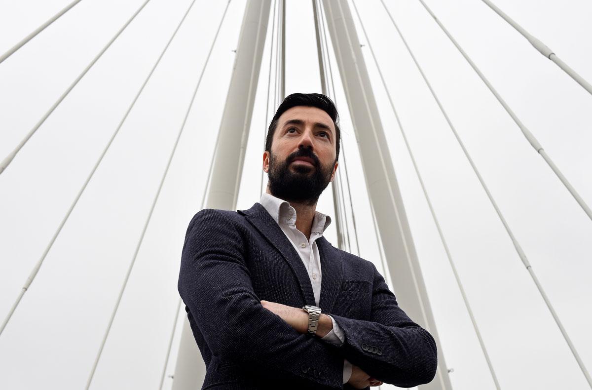 Paolo Esposito, an Italian national working in financial services on a footbridge over the River Thames in London.